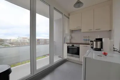 Cuisine ou kitchenette dans l'établissement Studio 76 - Balcon, proche Bâle