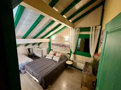 Un ou plusieurs lits dans un hébergement de l'établissement Chalet cosy dans les Hautes-Vosges avec spa - FR-1-589-673