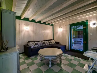 Coin salon dans l'établissement Chalet cosy dans les Hautes-Vosges avec spa - FR-1-589-673