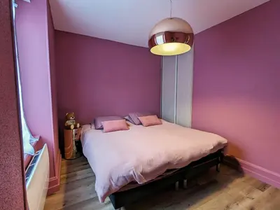 Un ou plusieurs lits dans un hébergement de l'établissement Appartement rénové avec jardin, parking et WiFi à Gérardmer - FR-1-589-678