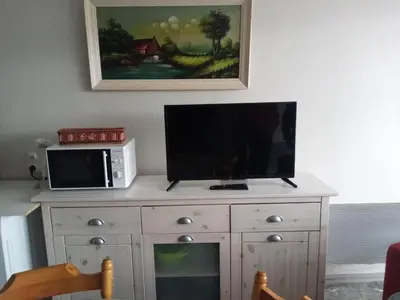 Télévision ou salle de divertissement dans l'établissement Charmant studio