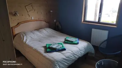 Un ou plusieurs lits dans un hébergement de l'établissement Chalet avec vue sur la vallée