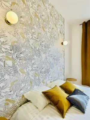 Un ou plusieurs lits dans un hébergement de l'établissement 101 - Appartement élégant art déco près du centre ville