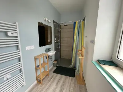 Télévision ou salle de divertissement dans l'établissement Cramiland - Appart 01 Ohnenheim