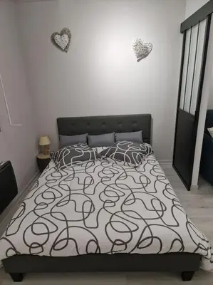 Un ou plusieurs lits dans un hébergement de l'établissement Appartement Au petit bonheur