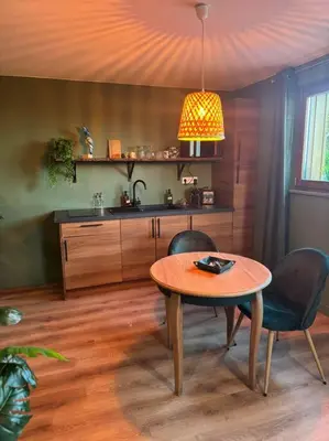 Cuisine ou kitchenette dans l'établissement Suite LIANA - SPA- SAUNA