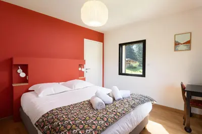Un ou plusieurs lits dans un hébergement de l'établissement Villa pleine nature - piscine, jacuzzi, sauna