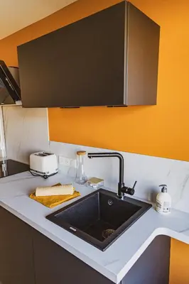 Cuisine ou kitchenette dans l'établissement Les Confiseries, appartement 2 pièces et terrasse