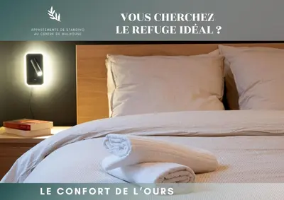Un ou plusieurs lits dans un hébergement de l'établissement Le Confort de l'Ours