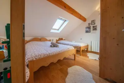 Un ou plusieurs lits dans un hébergement de l'établissement Le chalet Montanea-Jacuzzi-Free parking
