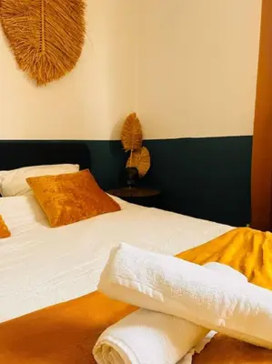 Un ou plusieurs lits dans un hébergement de l'établissement Cosy City