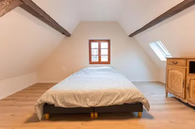 Un ou plusieurs lits dans un hébergement de l'établissement Zellenberg - Gîte d'Aksel