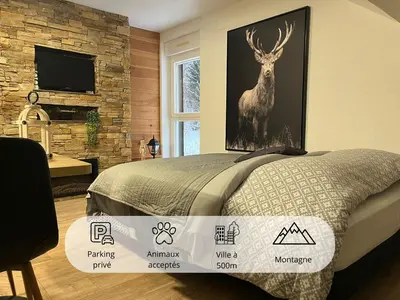 Un ou plusieurs lits dans un hébergement de l'établissement Studio Chalet des Pistes