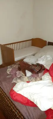 Un ou plusieurs lits dans un hébergement de l'établissement Privat Zimmer in rue des abeilles