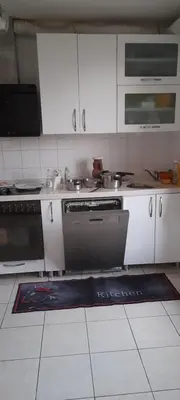 Cuisine ou kitchenette dans l'établissement Privat Zimmer in rue des abeilles