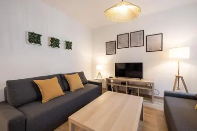 Coin salon dans l'établissement MonSéjourCosy - L'Escapade - Spacieux - Netflix