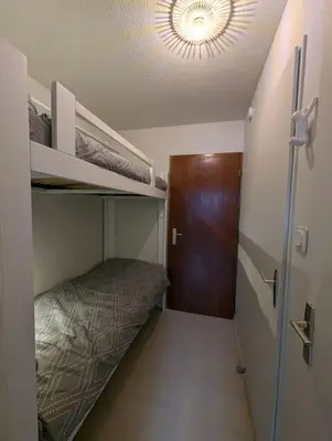 Un ou plusieurs lits dans un hébergement de l'établissement Chez Paulette, Studio cosy au centre ville de Gérardmer