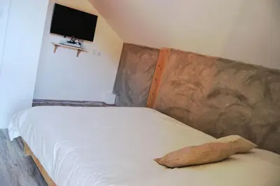 Un ou plusieurs lits dans un hébergement de l'établissement Chalet Au Cottage des Lynx
