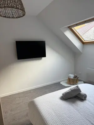 Un ou plusieurs lits dans un hébergement de l'établissement Appartement Le Belarya