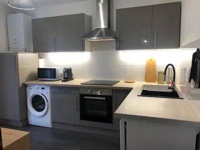 Cuisine ou kitchenette dans l'établissement Appartement Les Sorbiers