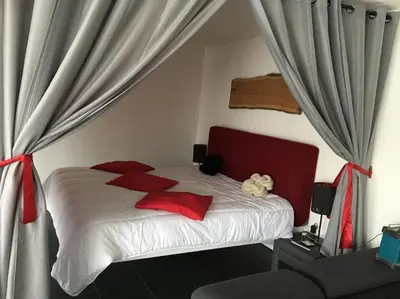 Un ou plusieurs lits dans un hébergement de l'établissement Loft le nid de cigogne