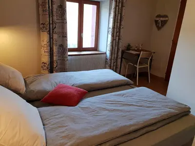 Un ou plusieurs lits dans un hébergement de l'établissement Chambres d'hôtes à la montagne, animaux acceptés - FR-1-589-735