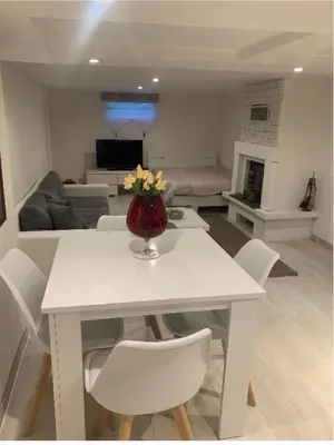 Coin salon dans l'établissement Studio dans une maison avec parking