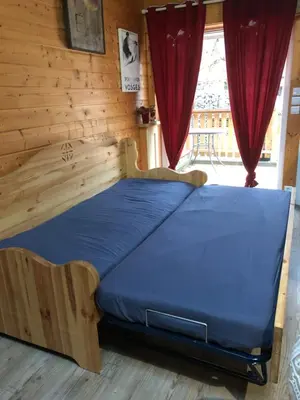 Un ou plusieurs lits dans un hébergement de l'établissement Chalet au coeur du vieux Gérardmer
