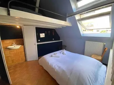 Un ou plusieurs lits dans un hébergement de l'établissement Colmar guesthouse in old town 6 people