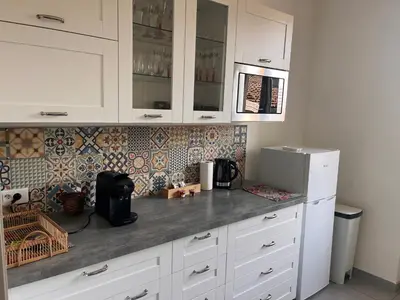 Cuisine ou kitchenette dans l'établissement Jardin de Victor Appartements calmes spacieux avec jardin clos