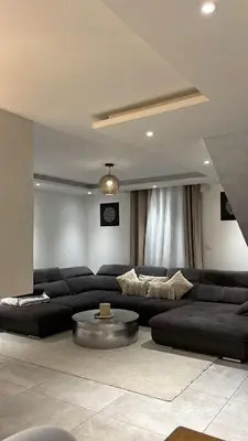 Coin salon dans l'établissement Maison 3 chambres