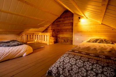 Un ou plusieurs lits dans un hébergement de l'établissement Chalet chevreuils du beillard