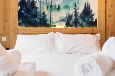 Un ou plusieurs lits dans un hébergement de l'établissement chalet zélcova et spa Gérardmer