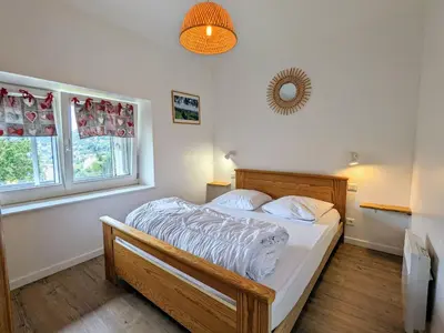 Un ou plusieurs lits dans un hébergement de l'établissement Gîte montagne La Bresse, balcon, Wi-Fi, parking proche ski - FR-1-589-699