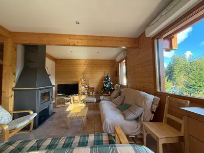 Coin salon dans l'établissement Le Chalet des Vanneaux