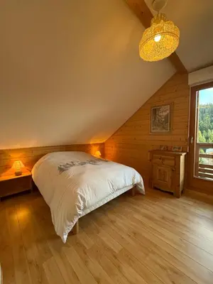 Un ou plusieurs lits dans un hébergement de l'établissement Le Chalet des Vanneaux
