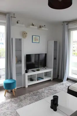 Télévision ou salle de divertissement dans l'établissement Appartement