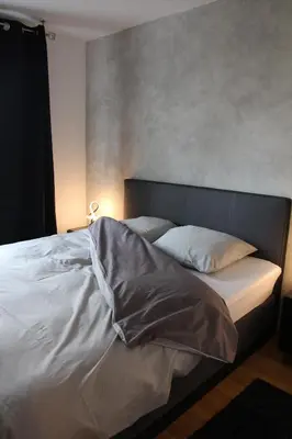 Un ou plusieurs lits dans un hébergement de l'établissement Appartement