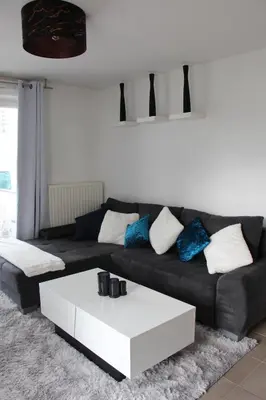 Coin salon dans l'établissement Appartement
