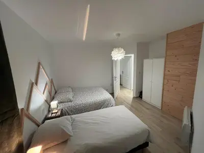 Un ou plusieurs lits dans un hébergement de l'établissement Naturel loft 5 personnes et jardin