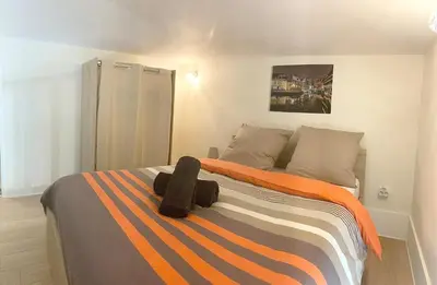 Un ou plusieurs lits dans un hébergement de l'établissement Appartement proche gare