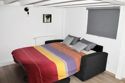 Un ou plusieurs lits dans un hébergement de l'établissement Appartement proche gare