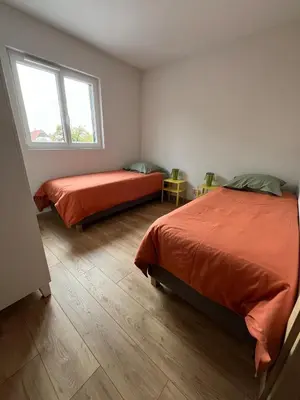 Un ou plusieurs lits dans un hébergement de l'établissement Gîte Cigogne et Sanglier