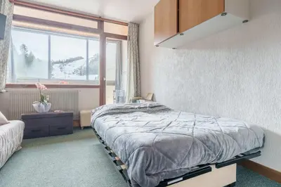Un ou plusieurs lits dans un hébergement de l'établissement Belle Hutte - La Bresse montagne et parking privé