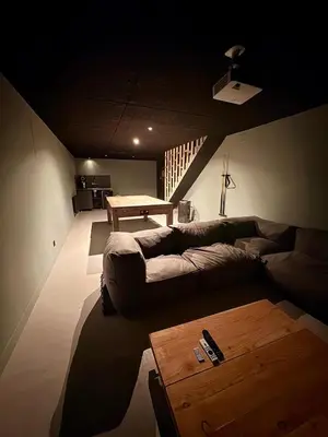 Coin salon dans l'établissement Chalet 14pers - jacuzzi&sauna - La Bresse