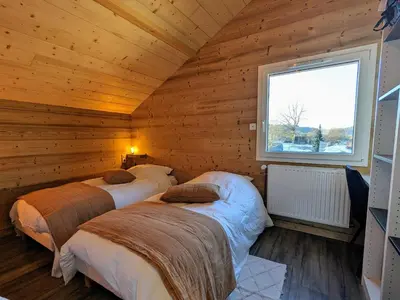 Un ou plusieurs lits dans un hébergement de l'établissement Chalet Nature avec Sauna et WIFI près Gérardmer - FR-1-589-777