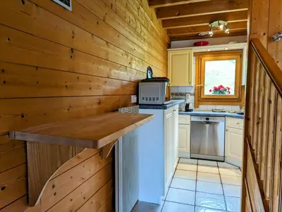Cuisine ou kitchenette dans l'établissement Chalet bois et pierre