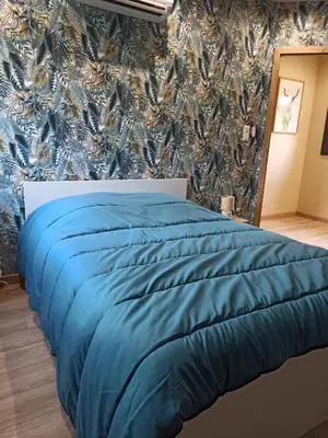 Un ou plusieurs lits dans un hébergement de l'établissement Chalet Le Nid Douillet avec jacuzzi et sauna privatifs