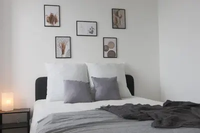 Un ou plusieurs lits dans un hébergement de l'établissement Le carré, appartement de ville
