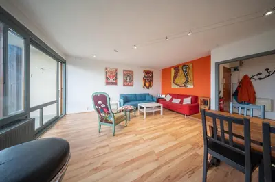 Coin salon dans l'établissement Marne 29 Logement Mulhouse Proche Tram Autoroute